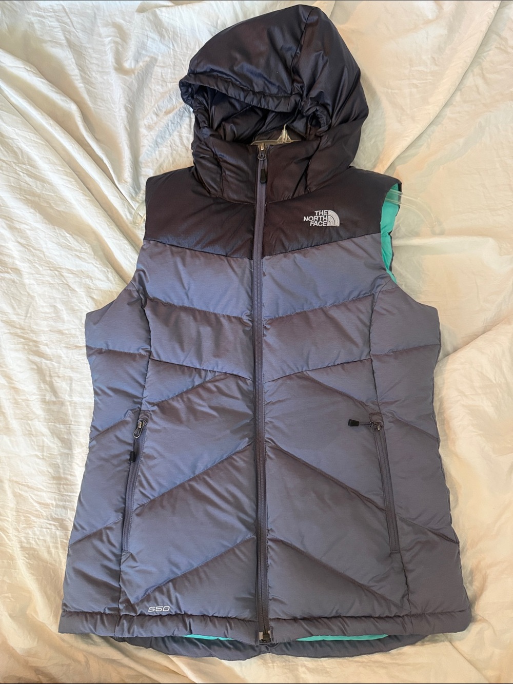 The North Face Women's Hooded Down Vest in gunmetal gray with Teal Lining